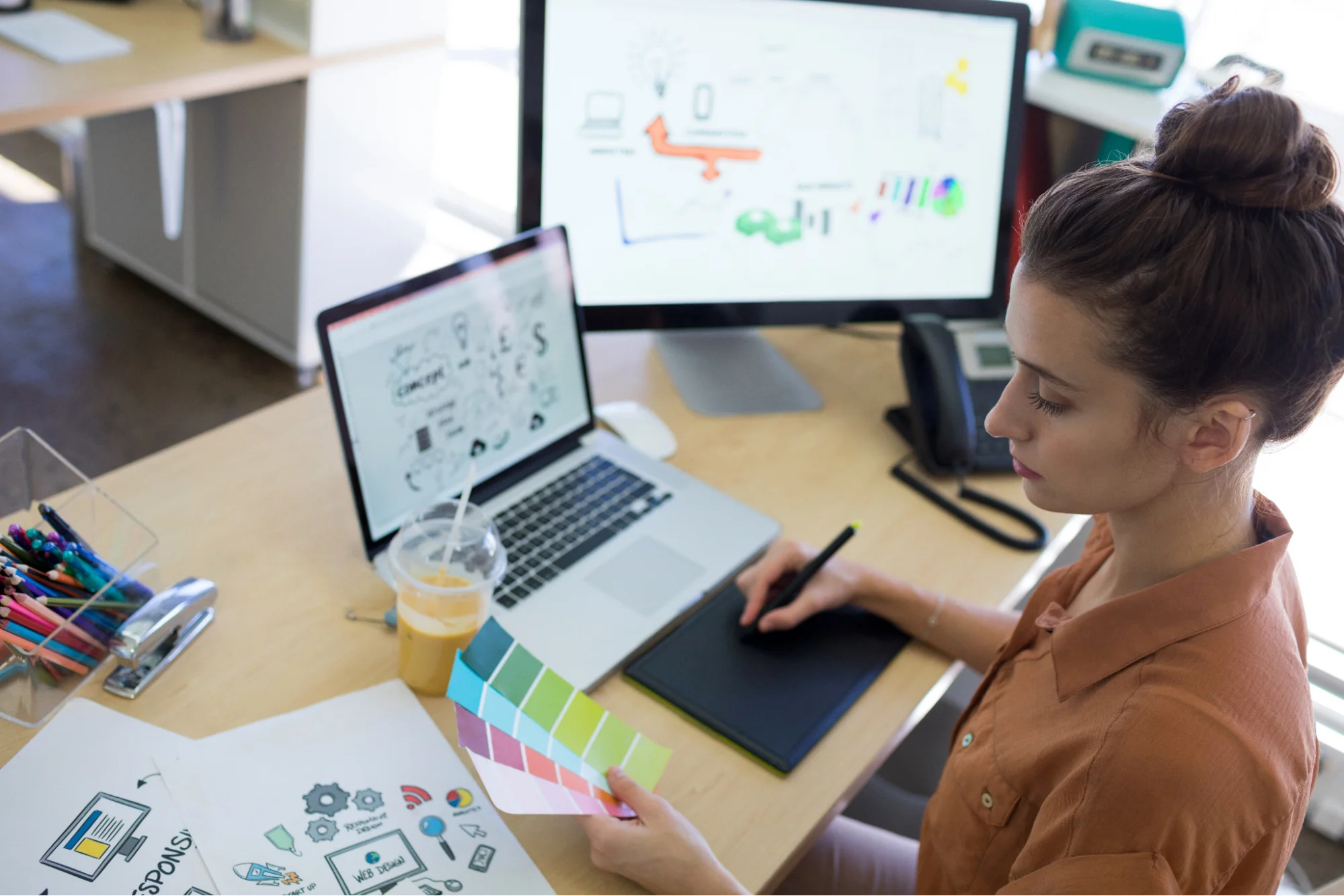 Illustrator referring to the colour scheme to create doodles. Illustrator referring to the colour scheme to create doodles.