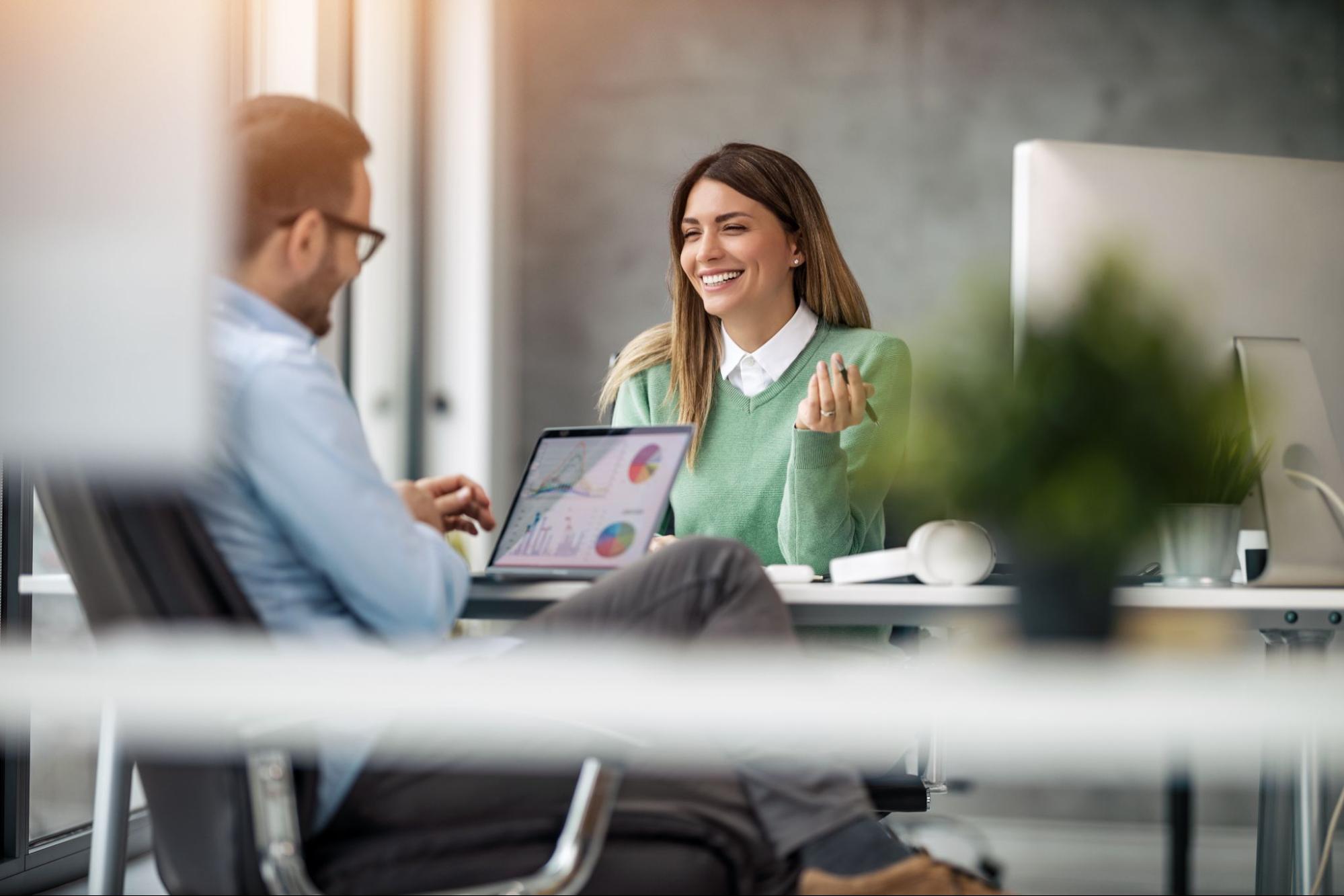 A graphic designer negotiating their salary with interviewer. A graphic designer negotiating their salary with interviewer.