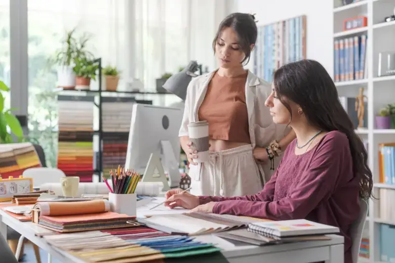 Two interior designers brainstorming project elements Two interior designers brainstorming project elements