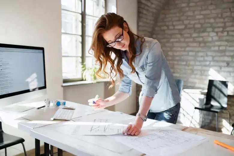 Interior architect working on floor plan sketches