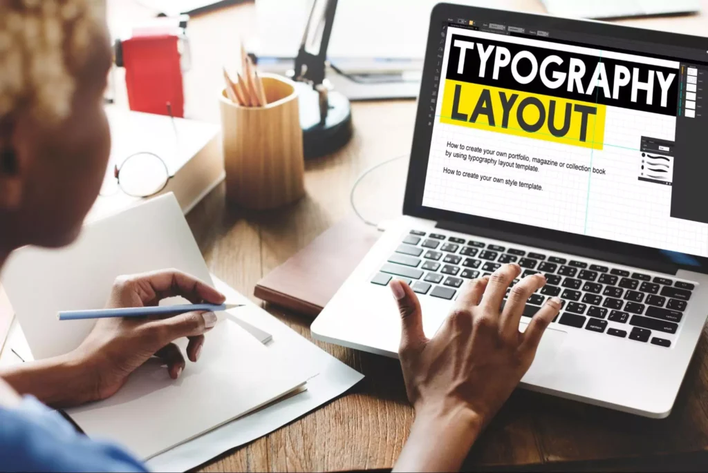 Graphic designer creating a typography layout
