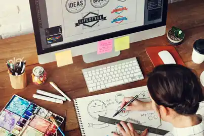 Young graphic designer designing a logo for a brand Young graphic designer designing a logo for a brand
