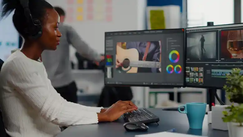 Visual designer working on their desktop Visual designer working on their desktop