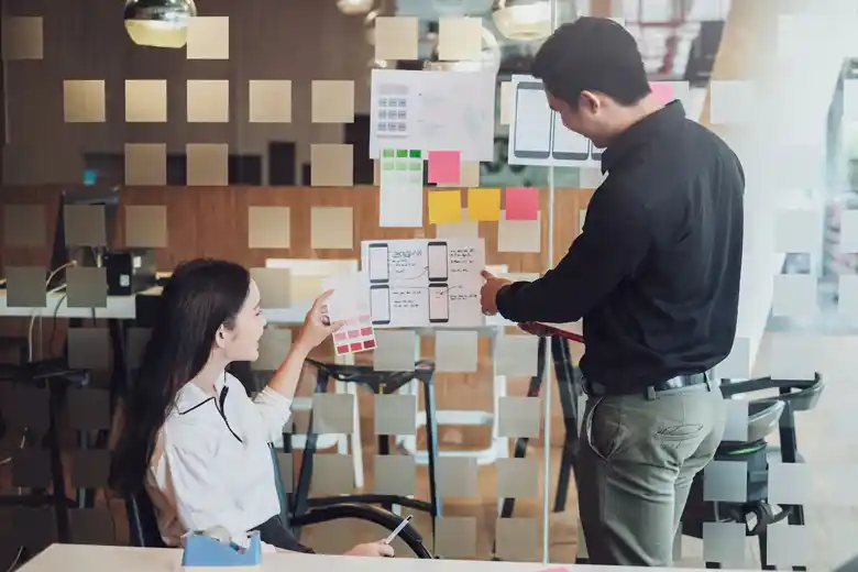  Experience designers mapping the user flow for an application
