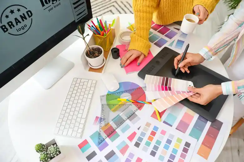 Designer working with colour swatches Designer working with colour swatches