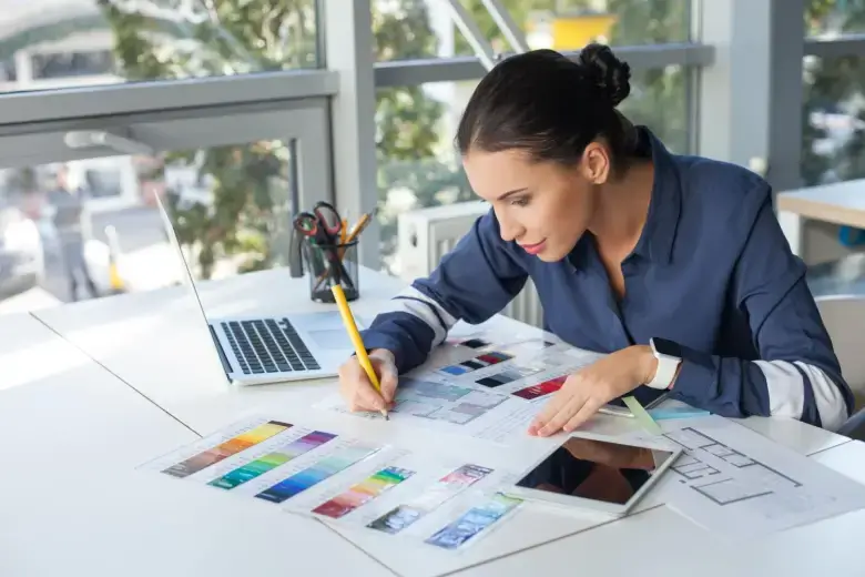 Designer colour-coding an interior design blueprint