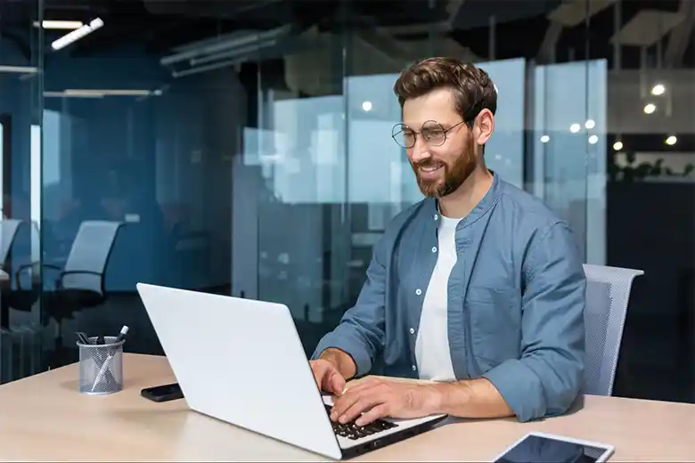 UI UX designer working on a laptop