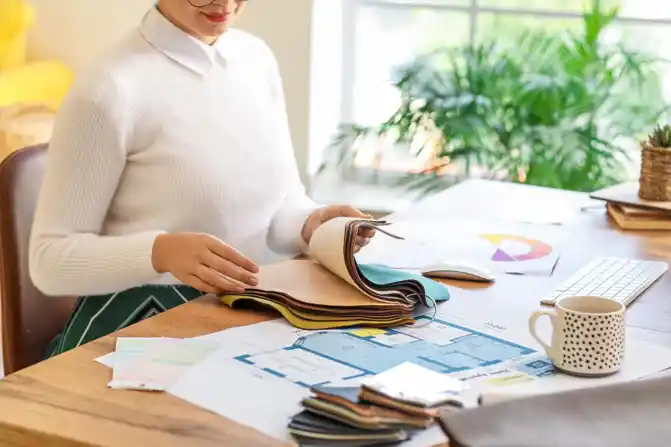 Person examining fabrics  for interior design project