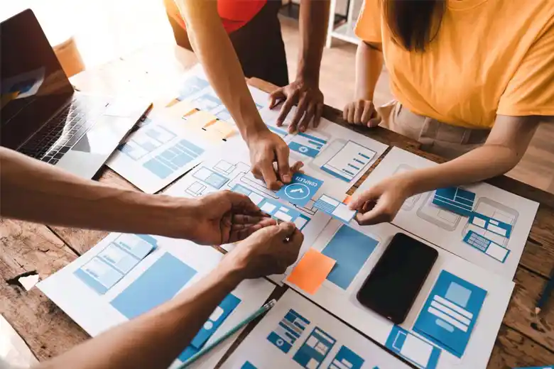 Team card sorting different features of a UI UX design Team card sorting different features of a UI UX design