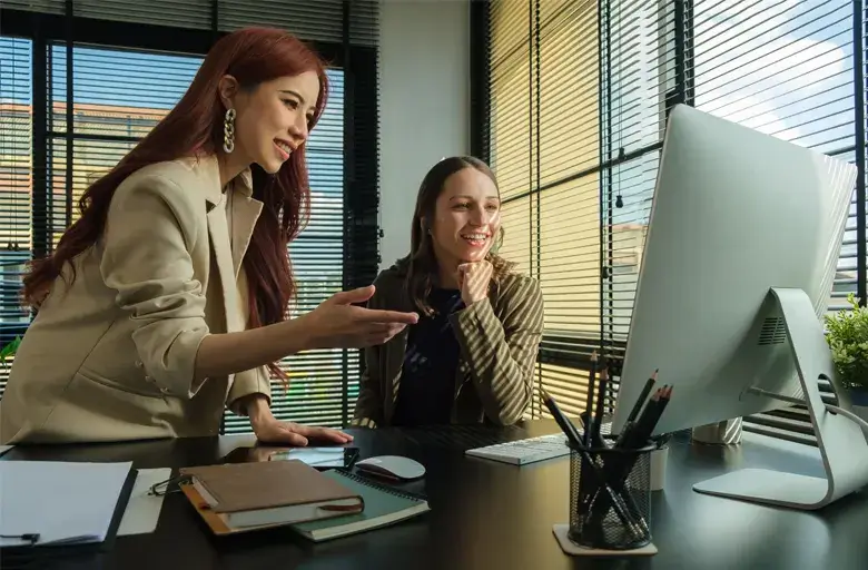 UX UI designers working on a desktop