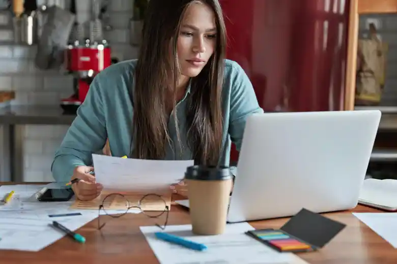 Woman looking at a laptop screen Woman looking at a laptop screen