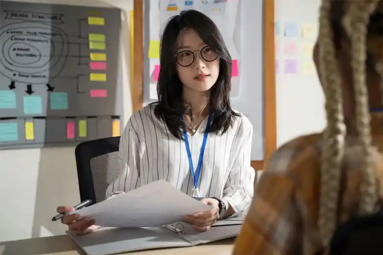 A UX UI designer conducting an interview for research purposes. A UX UI designer conducting an interview for research purposes.