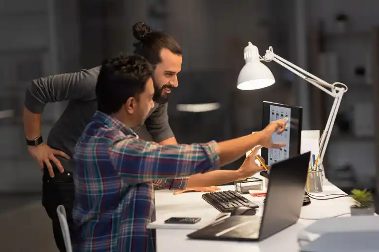UI designers examining the features and flow of an application