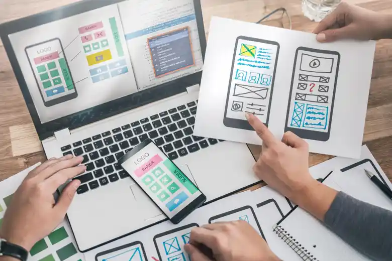 UX UI designers finalising a wireframe for an application.