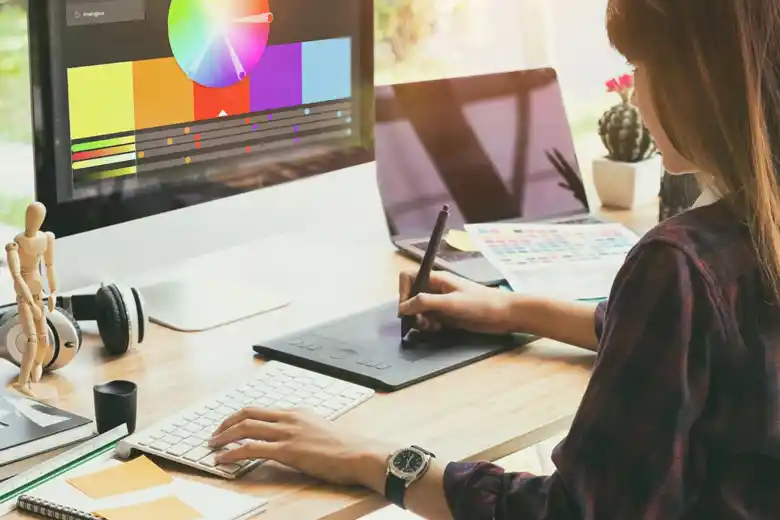 Branding designer using the colour wheel to create a sketch Branding designer using the colour wheel to create a sketch