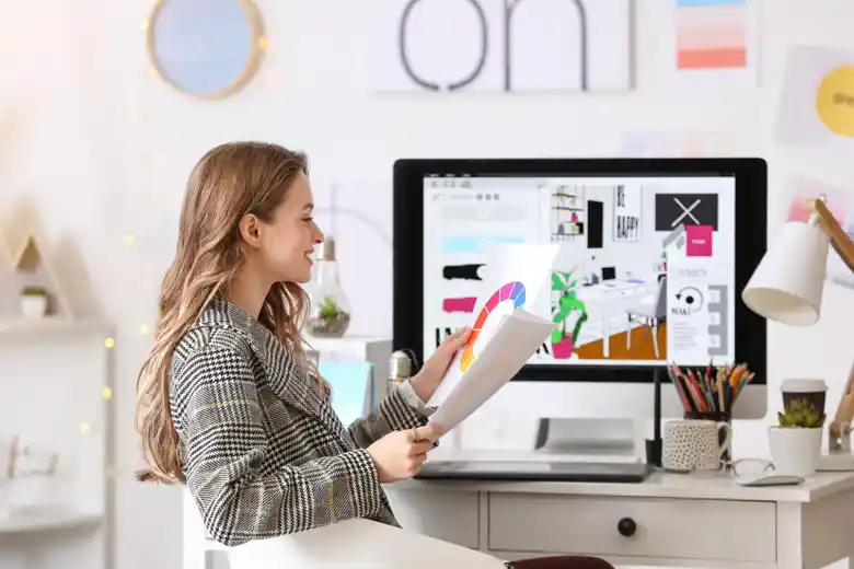 Graphic designer completing a design task. Graphic designer completing a design task.