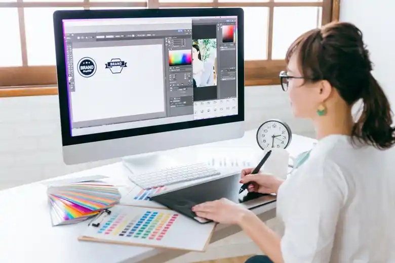 Logo designer making rough sketches for brand logo Logo designer making rough sketches for brand logo