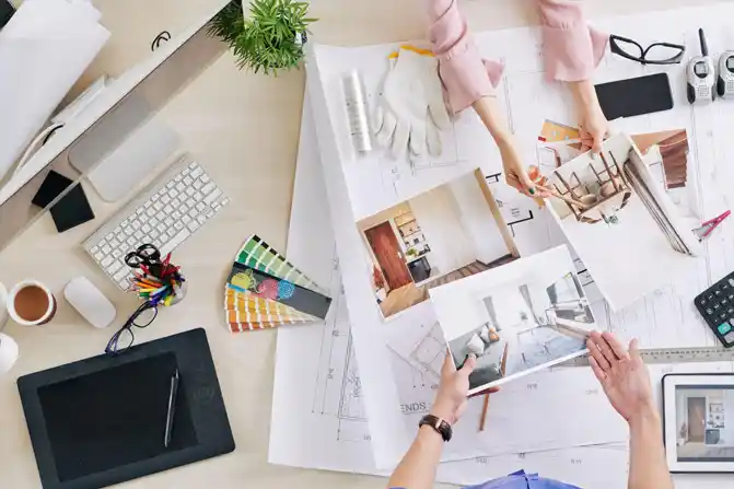 Designers reviewing the 3D rendering of a residential interior design project