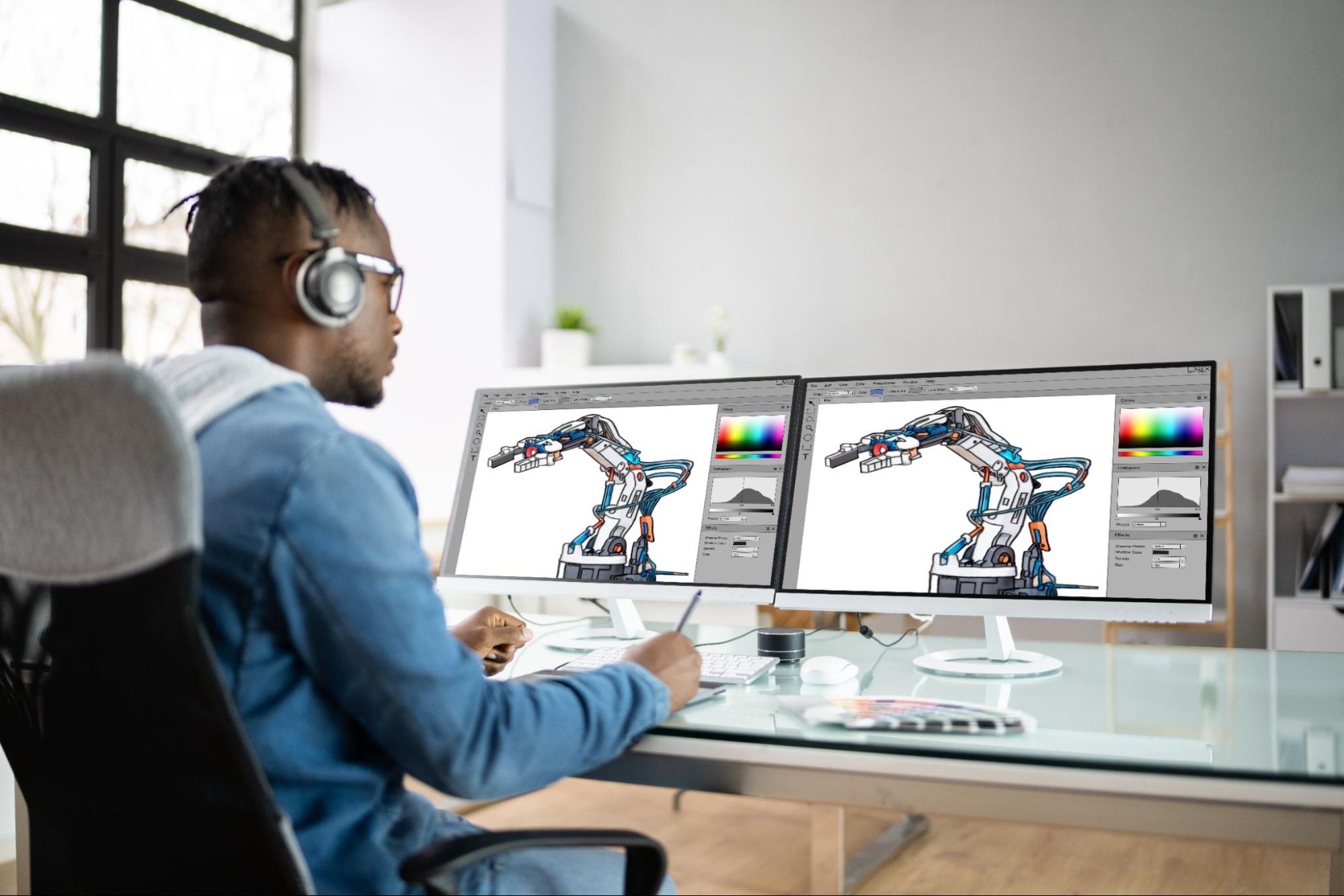 Graphic designer creating 3D renders of a machine on Adobe Photoshop