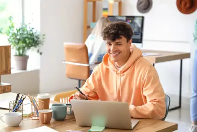 Logo designer working on a laptop