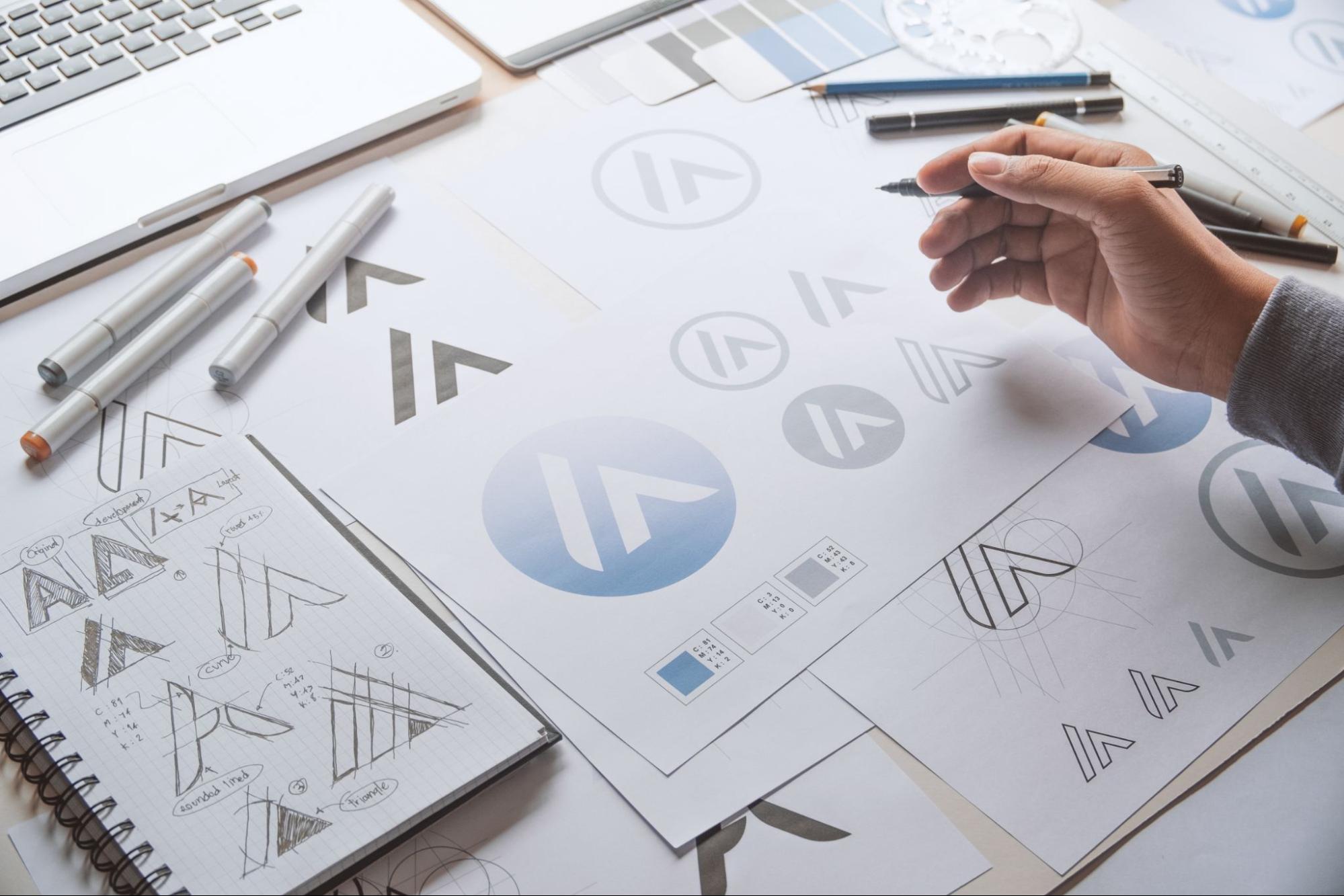 A designer working on creating a logo. A designer working on creating a logo.