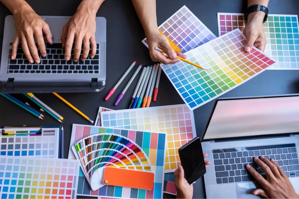 Visual designers working with colour palettes