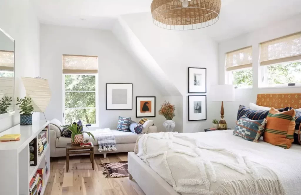 Bedroom design with a dedicated seating corner.