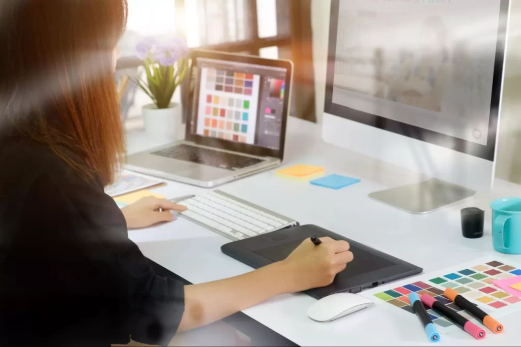 A graphic designer colour correcting an image.
A graphic designer colour correcting an image.