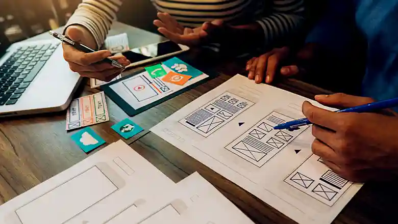 Designers using card sorting to create a user-friendly mobile interface Designers using card sorting to create a user-friendly mobile interface
