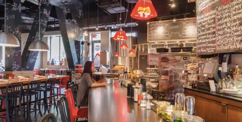 A cafe with a an open kitchen layout A cafe with a an open kitchen layout