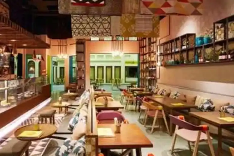 A cafe interior design with a blend of elements, motifs, and influences from various cultures around the world
A cafe interior design with a blend of elements, motifs, and influences from various cultures around the world
