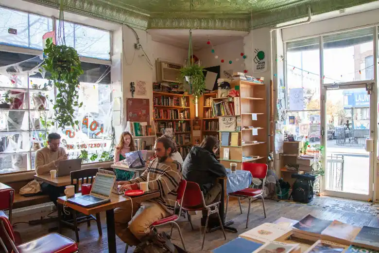 A cafe with a communal book shelf A cafe with a communal book shelf
