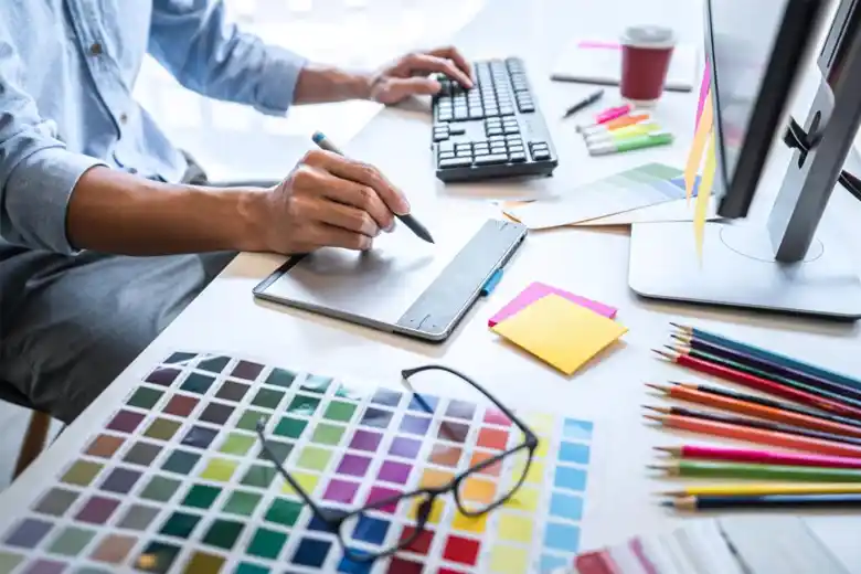 Residential interior designer finalizing the colour palette for a room design plan Residential interior designer finalizing the colour palette for a room design plan