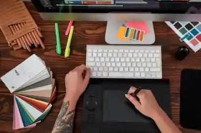 Graphic designer using a digital pad for an illustration