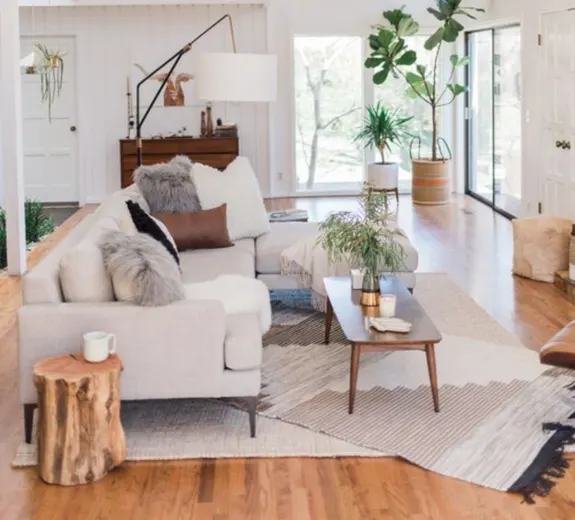 A living room designed with layered rugs A living room designed with layered rugs