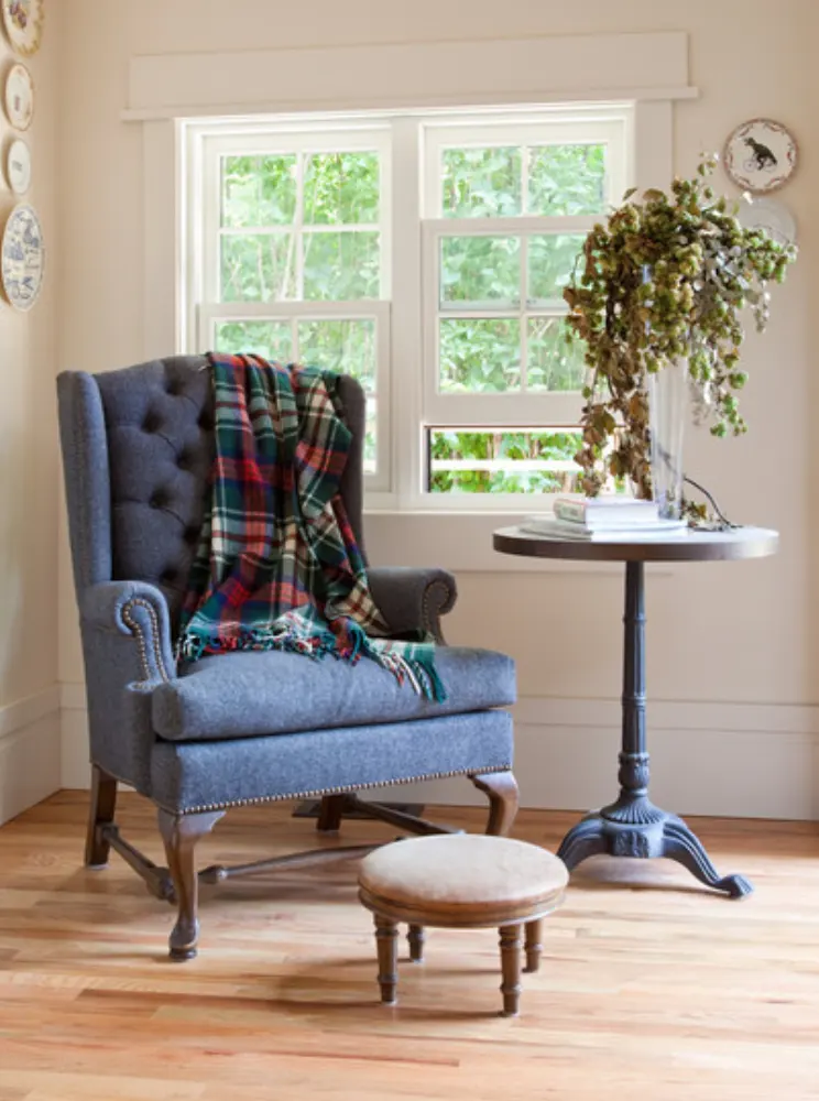 A wingback chair with a foot stool
A wingback chair with a foot stool