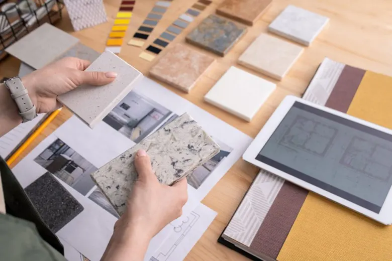 Residential designer examining flooring options for a project Residential designer examining flooring options for a project