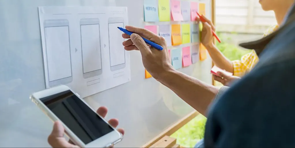 A UX UI Design expert helping a student create an application's user interface A UX UI Design expert helping a student create an application's user interface