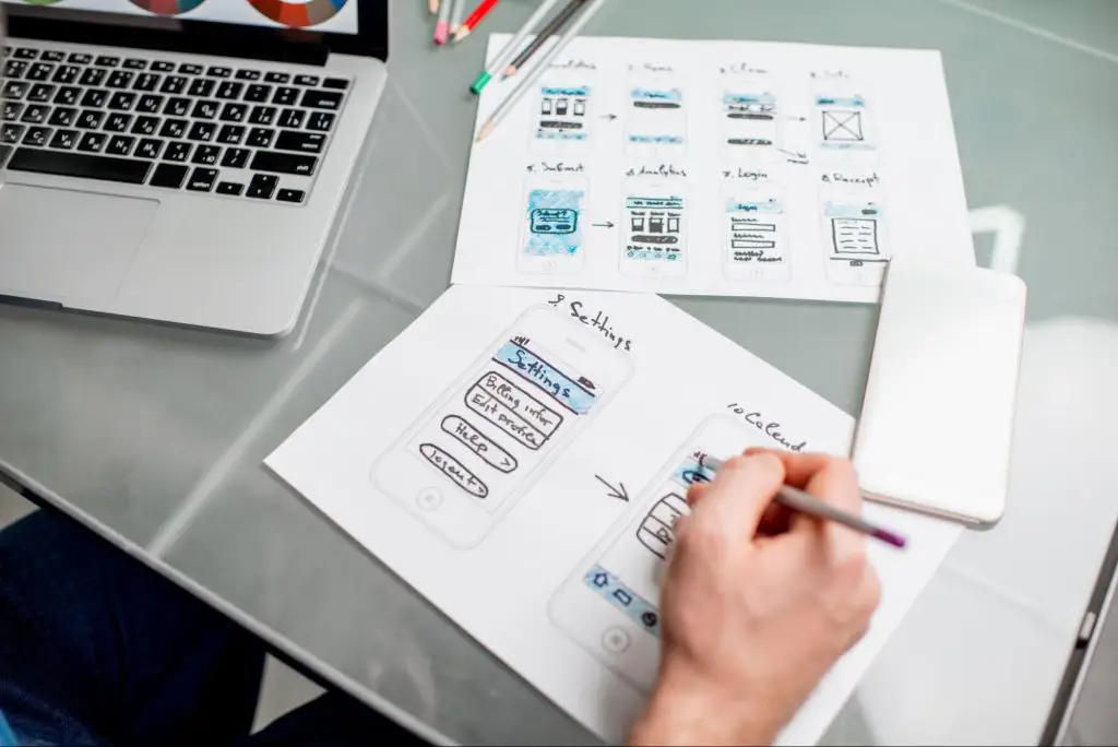 Visual designer creating different features and functions of a mobile application.