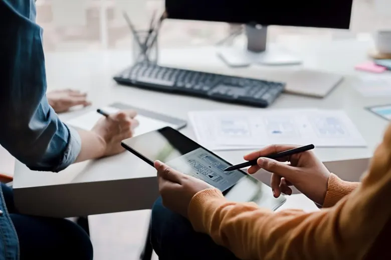 A UI Developer examining the interface designed by the UI designer