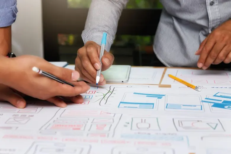 A UI designer and UI developer collaborating on a application design
