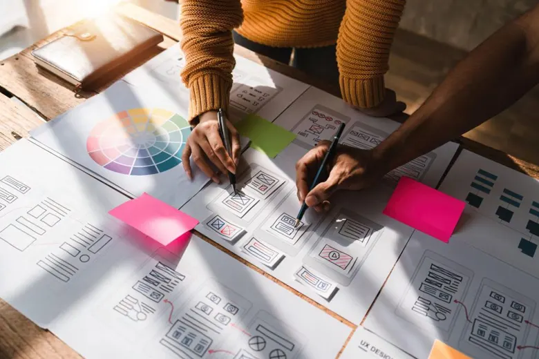 Experience designers using card sorting to brainstorm Experience designers using card sorting to brainstorm