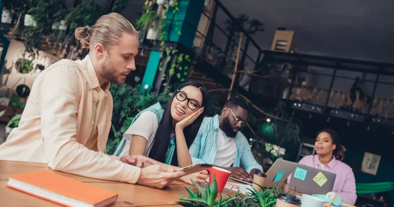 A team of UI U X designers collaborating in a creative workspace
