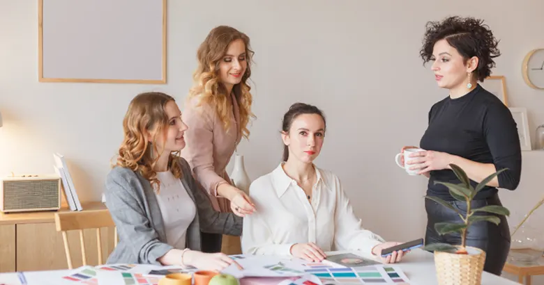 A team of graphic designers finalising the colour palette.