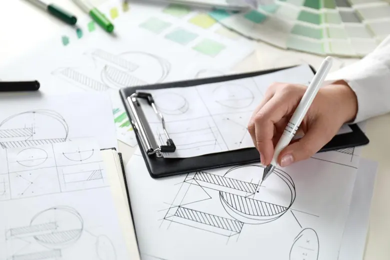 designer creating rough sketches for a logo design