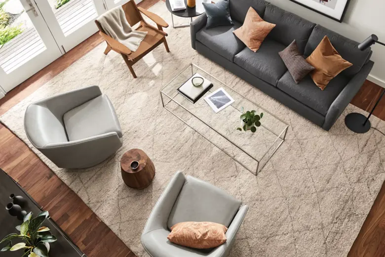 Large rug used to define zones and maximise space Large rug used to define zones and maximise space