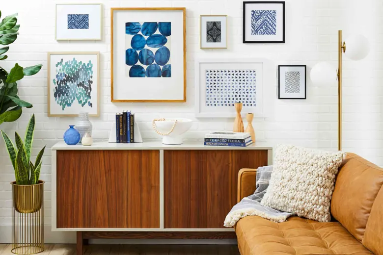Plain living room wall decorated with photo frames and artwork
Plain living room wall decorated with photo frames and artwork