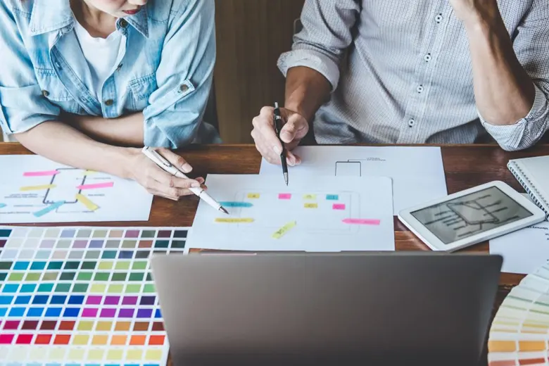 A professional UX UI Designer mentoring a junior interaction designer A professional UX UI Designer mentoring a junior interaction designer