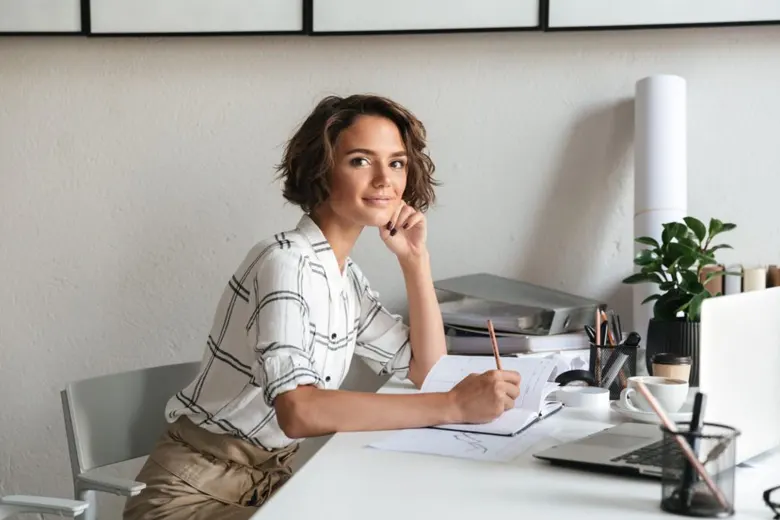 A young student taking notes while attending a live session in her online home interior design course
A young student taking notes while attending a live session in her online home interior design course