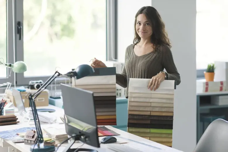 Professional interior stylist selecting fabrics for a residential interior project